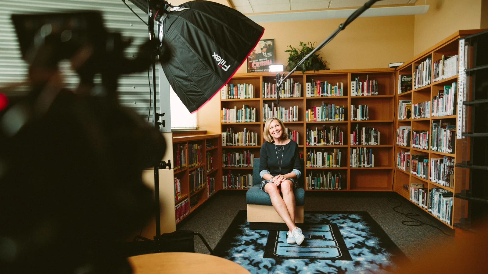A video interview being filmed in a library